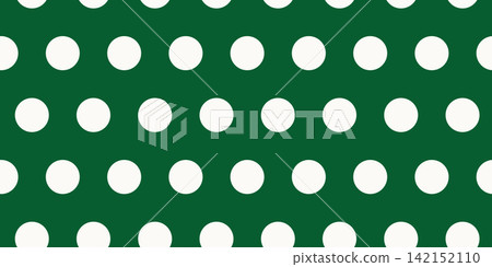 Simple festive seamless Christmas pattern has white polka dots on green background Simple festive seamless Christmas pattern has white polka dots on green background 142152110