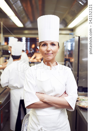 Restaurant, pride and portrait of woman in kitchen for hospitality, service and cuisine. Fine dining, confidence and chef with arms crossed in food industry for catering, job and career in Denmark Restaurant, pride and portrait of woman in kitchen for hospitality, service and cuisine. Fine dining, confidence and chef with arms crossed in food industry for catering, job and career in Denmark 142152121