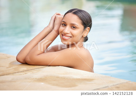 Woman, portrait and pool for relax with smile for travel with water in summer with confidence at poolside. Beautiful, peaceful and holiday in the Bali with luxury at resort with pride for wellness Woman, portrait and pool for relax with smile for travel with water in summer with confidence at poolside. Beautiful, peaceful and holiday in the Bali with luxury at resort with pride for wellness 142152128
