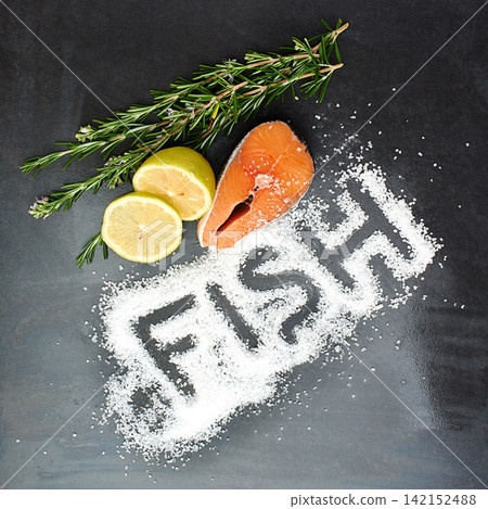 Salmon, herbs and seasoning on table top for menu development, nutrition and wellness in restaurant. Fish, salt and protein in studio for health, diet and ingredients for cooking on dark background. Salmon, herbs and seasoning on table top for menu development, nutrition and wellness in restaurant. Fish, salt and protein in studio for health, diet and ingredients for cooking on dark background. 142152488