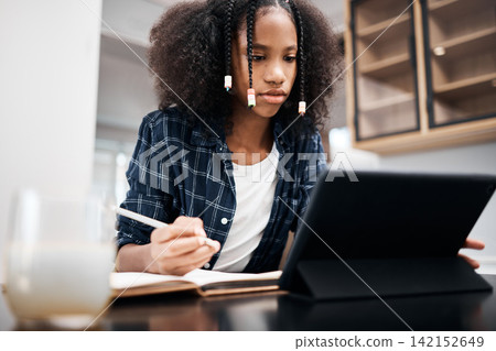African girl, tablet and notebook in home for education, mobile learning and research for study and scholarship. Student, serious and tech for internet, web project and writing on desk for exam test African girl, tablet and notebook in home for education, mobile learning and research for study and scholarship. Student, serious and tech for internet, web project and writing on desk for exam test 142152649