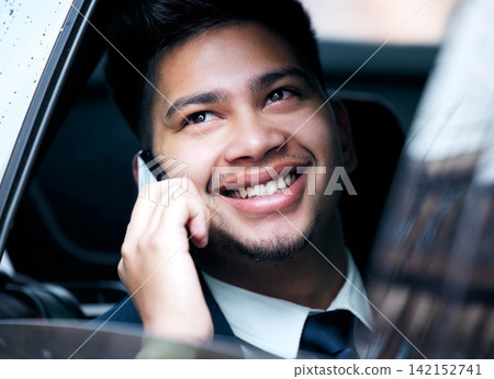 Happy, phone call or businessman in taxi to travel on urban commute in communication on drive. Car transport, back seat or entrepreneur thinking in mobile conversation on cab ride to work or city Happy, phone call or businessman in taxi to travel on urban commute in communication on drive. Car transport, back seat or entrepreneur thinking in mobile conversation on cab ride to work or city 142152741