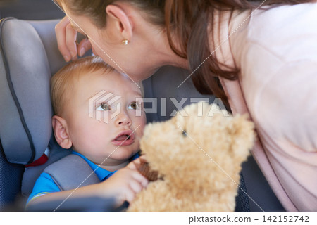 Travel, safety and mom with baby in car seat on road trip, journey or motor security insurance. Child, lock and seatbelt in vehicle for transport protection and kiss kid with teddy bear and toys Travel, safety and mom with baby in car seat on road trip, journey or motor security insurance. Child, lock and seatbelt in vehicle for transport protection and kiss kid with teddy bear and toys 142152742