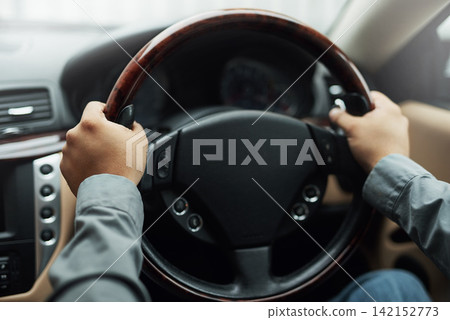 Car, dashboard and hands driving for travel, holiday or roadside adventure. Person, vehicle and steering wheel for transportation, vacation or taxi delivery and professional ride share services 142152773