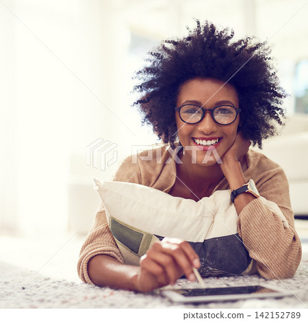 Black woman, portrait and afro with tablet for creative interior design, creativity or remote work on living room floor. African, female person or freelancer with smile on technology for home startup Black woman, portrait and afro with tablet for creative interior design, creativity or remote work on living room floor. African, female person or freelancer with smile on technology for home startup 142152789