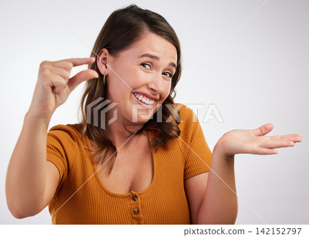 Portrait, smile or woman with small hand palm space in studio for scale, comparison or measurement on white background. Unsure, face or model guess with finger gesture for emoji, doubt or mockup size Portrait, smile or woman with small hand palm space in studio for scale, comparison or measurement on white background. Unsure, face or model guess with finger gesture for emoji, doubt or mockup size 142152797
