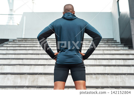 African man, confident and sports, stairs and stadium for training, outdoor or workout on stands for wellness. Male athlete, sportswear and break in exercise for tournament, competition or contest 142152804