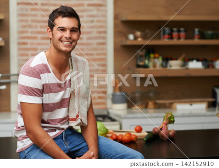 Cooking, smile and portrait of man in kitchen for food, wellness and nutrition with confidence. Healthy dinner, diet and chef cutting vegetables with towel at home for lunch, vegan or salad in France Cooking, smile and portrait of man in kitchen for food, wellness and nutrition with confidence. Healthy dinner, diet and chef cutting vegetables with towel at home for lunch, vegan or salad in France 142152910
