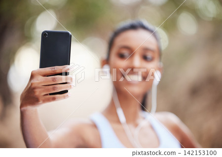 Fitness, selfie and woman hand in park for training, profile picture or running photography in nature. Sports, smartphone and health influencer in forest for live streaming, blog or content creation Fitness, selfie and woman hand in park for training, profile picture or running photography in nature. Sports, smartphone and health influencer in forest for live streaming, blog or content creation 142153100