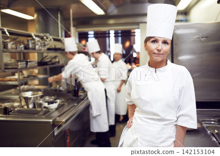 Restaurant, chef and portrait of woman in kitchen for hospitality service, cuisine and career. Fine dining, cook and face of person in food industry for catering, job and culinary in Barcelona 142153104