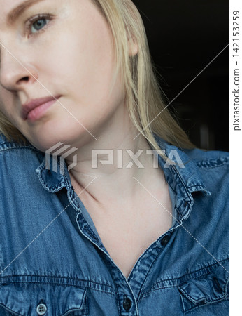 Close up of a woman showing venus rings and neck lines for skin aging, mesotherapy, and biorevitalisation treatments. Ideal for tech neck issues, cosmetology, and aesthetic dermatology. 142153259
