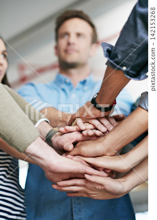 Group, team and unity with hands together at office for collaboration, synergy or agreement. Closeup of people or creative employees piling for motivation, help or startup in solidarity at workplace Group, team and unity with hands together at office for collaboration, synergy or agreement. Closeup of people or creative employees piling for motivation, help or startup in solidarity at workplace 142153268