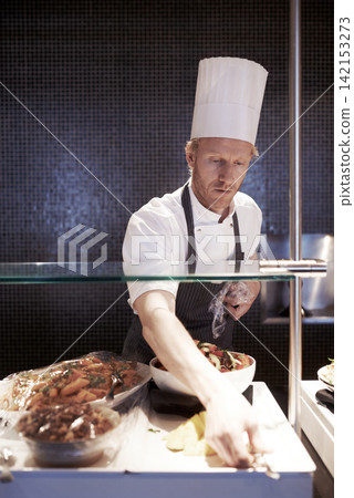 Male, chef and food in kitchen of restaurant for catering industry for meal with hospitality or fine dining with nutrition. Professional, expert and cooking cuisine for lunch or dinner for service Male, chef and food in kitchen of restaurant for catering industry for meal with hospitality or fine dining with nutrition. Professional, expert and cooking cuisine for lunch or dinner for service 142153273