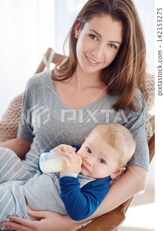 Portrait, mother and child in feeding, milk and bottle for development, motor skills and childhood at home. Woman, baby and nursing for health, nutrition and support in nursery for growth or wellness Portrait, mother and child in feeding, milk and bottle for development, motor skills and childhood at home. Woman, baby and nursing for health, nutrition and support in nursery for growth or wellness 142153275