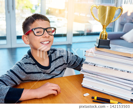 Portrait, child and smile of student with trophy for success, winning or education achievement in home. Face, kid and school reward of champion in glasses for learning competition or award in Germany Portrait, child and smile of student with trophy for success, winning or education achievement in home. Face, kid and school reward of champion in glasses for learning competition or award in Germany 142153503