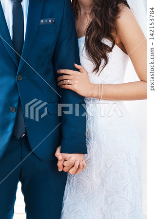 Wedding, couple and holding hands with love in marriage or luxury fashion and jewellery. Engagement, diamond ring and man with commitment to bride at event with trust, loyalty and respect for partner Wedding, couple and holding hands with love in marriage or luxury fashion and jewellery. Engagement, diamond ring and man with commitment to bride at event with trust, loyalty and respect for partner 142153784