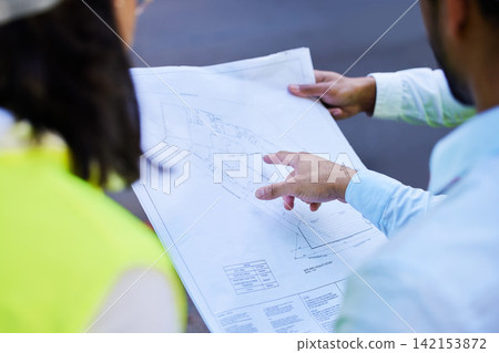 People, meeting and blueprint in hands for construction planning and project management logistics. Architecture, discussion and team collaboration on home renovation or building strategy and safety People, meeting and blueprint in hands for construction planning and project management logistics. Architecture, discussion and team collaboration on home renovation or building strategy and safety 142153872