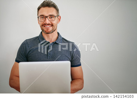 Businessman, portrait and happy in studio with laptop, relax and confidence of employee or staff. Creative, designer and male person, startup and worker with pride, company and model in job Businessman, portrait and happy in studio with laptop, relax and confidence of employee or staff. Creative, designer and male person, startup and worker with pride, company and model in job 142154103