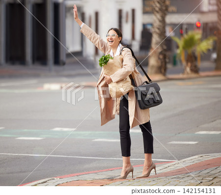Business woman, wave in street and taxi with grocery shopping, paper bag and waiting for transport in city. Ride share, lift and travel after buying food, arm up for car service and commute downtown Business woman, wave in street and taxi with grocery shopping, paper bag and waiting for transport in city. Ride share, lift and travel after buying food, arm up for car service and commute downtown 142154131