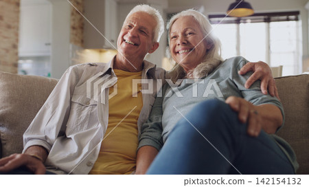 Senior couple, happy and watching tv on sofa in house, home and living room in retirement together. Movie, elderly people and relax with smile on couch for comedy, live streaming and funny video Senior couple, happy and watching tv on sofa in house, home and living room in retirement together. Movie, elderly people and relax with smile on couch for comedy, live streaming and funny video 142154132