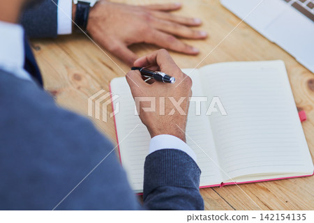 Man, notebook and laptop on workspace for student or professional for research, study or business. Technology, notes and pen on desk for working person, school and learning on table in office Man, notebook and laptop on workspace for student or professional for research, study or business. Technology, notes and pen on desk for working person, school and learning on table in office 142154135