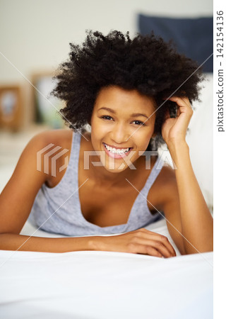 Black woman, wake up and portrait in home bedroom for sleep, rest and recovery or alone time on weekend. Female person, peaceful or comfortable in bed awake for morning, break or holiday in apartment 142154136