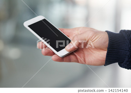 Person, hand and phone with mockup screen for advertising, marketing or app display at the office. Closeup of user touching or typing on mobile smartphone for online search, browsing or scrolling Person, hand and phone with mockup screen for advertising, marketing or app display at the office. Closeup of user touching or typing on mobile smartphone for online search, browsing or scrolling 142154140