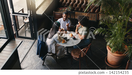 Group, colleagues and talking in coffee shop or brainstorming startup idea, planning or collaboration. Man, woman and diversity teamwork with notebook or creative company vision, lunch or discussion Group, colleagues and talking in coffee shop or brainstorming startup idea, planning or collaboration. Man, woman and diversity teamwork with notebook or creative company vision, lunch or discussion 142154235