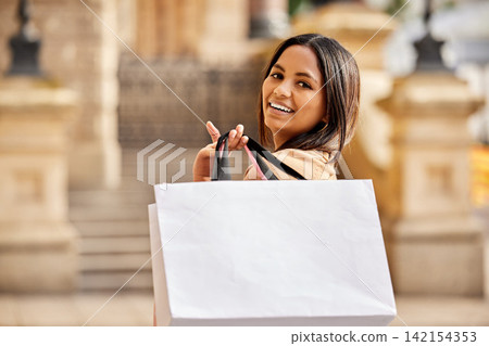 Portrait, shopping bag and woman in city happy on urban street for boutique, retail and clothing sale. Female person, packages and smile outdoors with luxury products for fashionable rich customer Portrait, shopping bag and woman in city happy on urban street for boutique, retail and clothing sale. Female person, packages and smile outdoors with luxury products for fashionable rich customer 142154353
