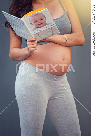 Pregnant woman, baby book and belly in studio for maternity and prenatal wellness for pregnancy and motherhood. Young person, happy and isolated with growing stomach or read for childbirth well being Pregnant woman, baby book and belly in studio for maternity and prenatal wellness for pregnancy and motherhood. Young person, happy and isolated with growing stomach or read for childbirth well being 142154518