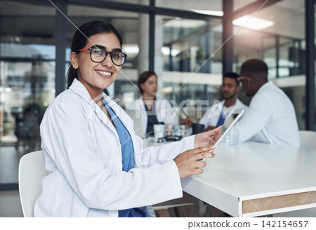 Portrait, woman and tablet for medicine research, wellness and results in office for healthcare. Nurse, medical student and Indian female doctor in hospital with digital notebook for brainstorming Portrait, woman and tablet for medicine research, wellness and results in office for healthcare. Nurse, medical student and Indian female doctor in hospital with digital notebook for brainstorming 142154657