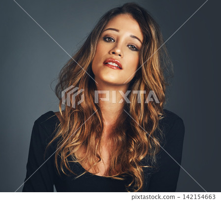 Woman, portrait and haircare or confidence in studio with smile, makeup and cosmetics with beauty. Model, fashion and healthy hair with shampoo treatment, dermatology or face glow on black background 142154663