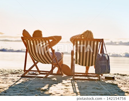 Back, chair or couple at sea to relax on holiday, vacation or anniversary romance in summer. Travel, wellness or people on date at beach or ocean for horizon view, calm peace or honeymoon in Hawaii Back, chair or couple at sea to relax on holiday, vacation or anniversary romance in summer. Travel, wellness or people on date at beach or ocean for horizon view, calm peace or honeymoon in Hawaii 142154756