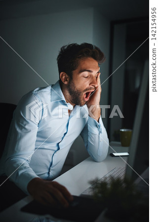 Man, tired and yawning in office with computer for coding, programming and software development at night. Business fatigue, late or night for information technology and engineer with burnout in dark 142154956