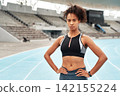 Confident, black woman or athlete portrait on sports track for fitness, running and training for competition. Female person, sportswear and outdoor on marathon field for workout, exercise and health 142155224
