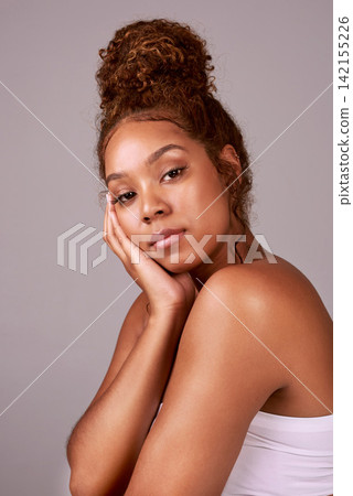 Woman, portrait and skincare or beauty in studio with glowing skin, facial treatment or dermatology. Cosmetics, model or person with confidence, healthy hair and self care routine on beige background Woman, portrait and skincare or beauty in studio with glowing skin, facial treatment or dermatology. Cosmetics, model or person with confidence, healthy hair and self care routine on beige background 142155226