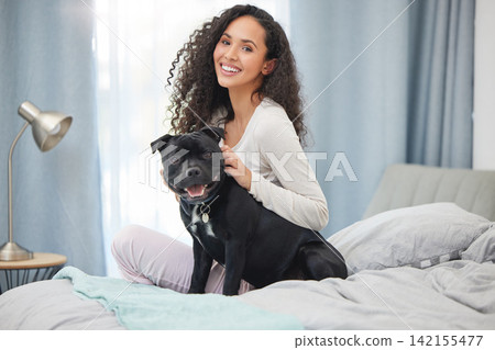 Happy, woman and portrait with dog in bedroom on holiday or relax in morning on vacation with pet. Girl, smile and love for animal on bed in calm home together with support, comfort and companion Happy, woman and portrait with dog in bedroom on holiday or relax in morning on vacation with pet. Girl, smile and love for animal on bed in calm home together with support, comfort and companion 142155477