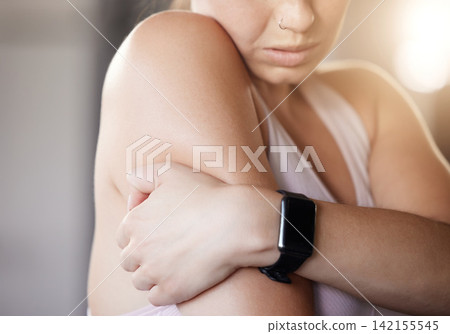 Arm pain, stress and hands of fitness woman at gym with anatomy, risk or emergency after training, exercise or cardio. Shoulder, injury and athlete with joint inflammation from intense body workout Arm pain, stress and hands of fitness woman at gym with anatomy, risk or emergency after training, exercise or cardio. Shoulder, injury and athlete with joint inflammation from intense body workout 142155545