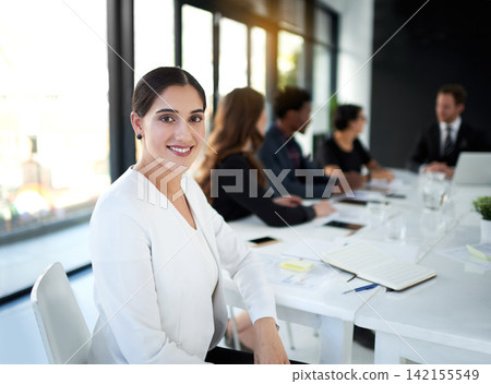 Meeting, portrait and businesswoman in conference room with confidence, business people and leadership. Boardroom, men and women in conversation for planning, strategy or workshop at startup office 142155549