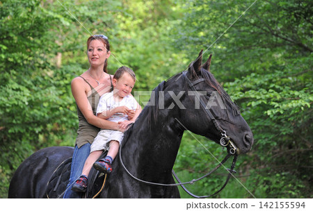 riding girl, child and horse in river riding girl, child and horse in river 142155594
