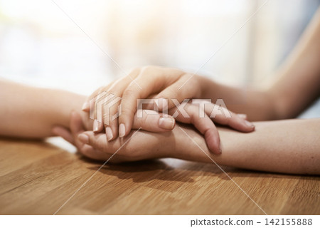 People, holding hands and grief support in home with empathy for mental health, loss or compassion. Friends, fingers and sympathy for bad news together or helping with trust, relationship or love People, holding hands and grief support in home with empathy for mental health, loss or compassion. Friends, fingers and sympathy for bad news together or helping with trust, relationship or love 142155888