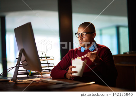 Late, night and businessman with fast food, computer and research for online project at startup. Reading, internet and consultant eating noodles at desk, checking email or report in dark office Late, night and businessman with fast food, computer and research for online project at startup. Reading, internet and consultant eating noodles at desk, checking email or report in dark office 142155940