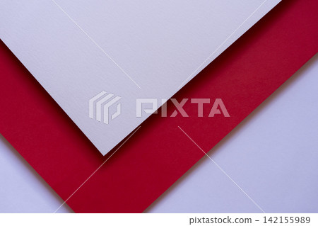 Overlapping white and red construction paper Overlapping white and red construction paper 142155989