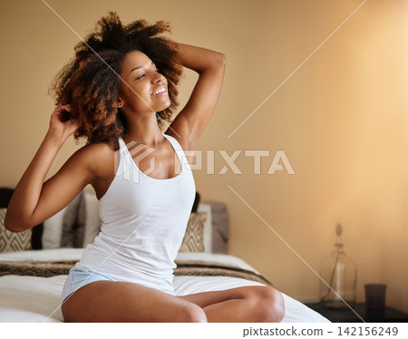 Home, morning and black woman stretching, awake and happiness with weekend break, healthy routine and stress relief. Bedroom, apartment and African person with wellness, peace and calm with smile Home, morning and black woman stretching, awake and happiness with weekend break, healthy routine and stress relief. Bedroom, apartment and African person with wellness, peace and calm with smile 142156249