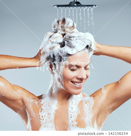 Shampoo, water or happy woman in shower for hair care, healthy hygiene or cleaning with soap foam. Studio, white background or wet girl with wellness or drops for beauty or liquid for morning routine Shampoo, water or happy woman in shower for hair care, healthy hygiene or cleaning with soap foam. Studio, white background or wet girl with wellness or drops for beauty or liquid for morning routine 142156254