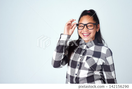 Eye care, studio and portrait of child with glasses for optometry, wellness and healthy eyesight. Mockup, girl and prescription spectacles of kid with smile, pride and confidence on white background 142156290