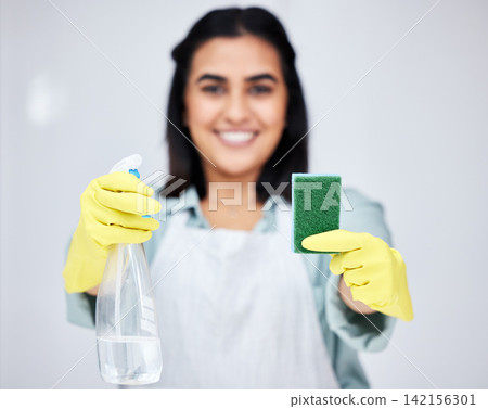 Cleaning, hands and woman with spray bottle or sponge for bacteria, cleaner or dirty furniture in studio. Grey background, maid or janitor ready to start washing with product, liquid soap or gloves 142156301