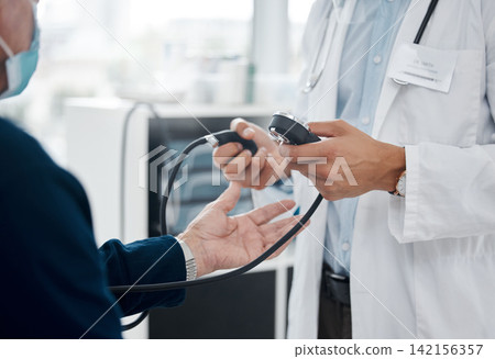 Doctor, blood pressure and patient check at hospital, healthcare and testing in assessment. Hands, consulting and cardiologist for examination at clinic, medical service and monitor heart rate Doctor, blood pressure and patient check at hospital, healthcare and testing in assessment. Hands, consulting and cardiologist for examination at clinic, medical service and monitor heart rate 142156357