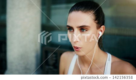 Earphones, girl or athlete in city ready for workout, training or outdoor exercise with radio music. Sports podcast, break or runner listening to audio for breathing, wellness and fitness in England Earphones, girl or athlete in city ready for workout, training or outdoor exercise with radio music. Sports podcast, break or runner listening to audio for breathing, wellness and fitness in England 142156358