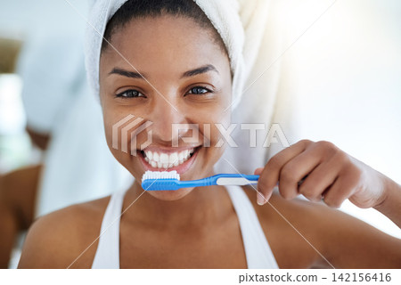 Black girl, portrait and toothbrush for oral hygiene in bathroom, morning and dental cleaning. Happy female person, healthcare and gum health for wellness, brushing and orthodontics for cosmetics Black girl, portrait and toothbrush for oral hygiene in bathroom, morning and dental cleaning. Happy female person, healthcare and gum health for wellness, brushing and orthodontics for cosmetics 142156416